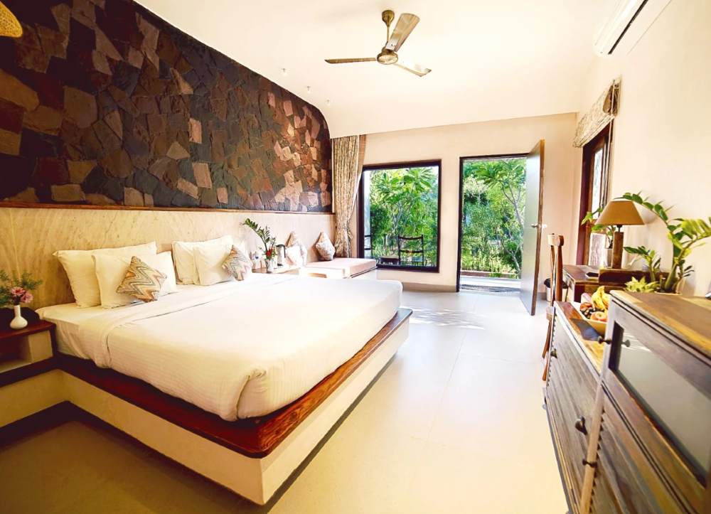 luxury-cottage-sitout-area-pugmark-resort-bedroom-outer-view