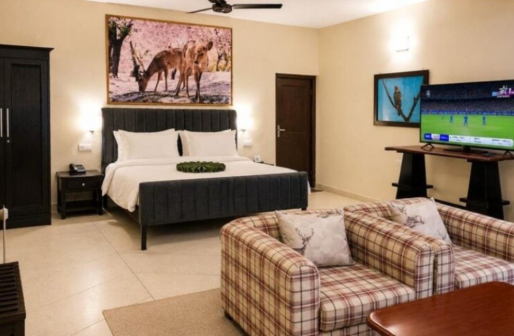 Bel-la-Monde-Riverside-Resort-Jim-Corbett-deluxe-room-bedroom-sofa-bed